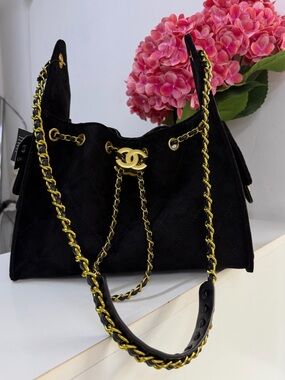 Black Suede Quilted Drawstring Shoulder Bag with Gold Hardware